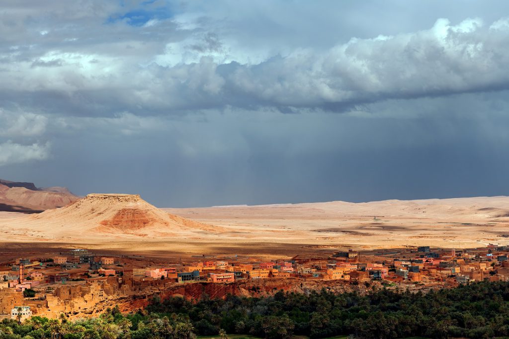Tinghir.Gardens, palm trees, the city, the hills, moody sky,Morocco North Africa Nikon D3x